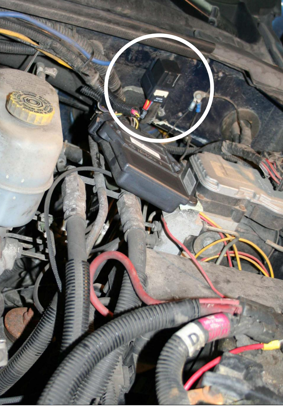 Wiring harness relay mounted to the firewall in the engine bay