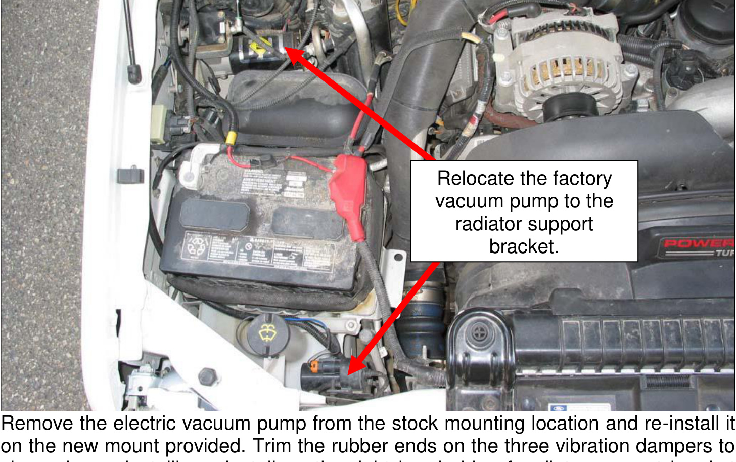 Factory vacuum pump relocated to the radiator support bracket
