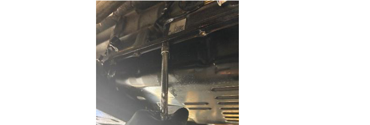 Removing the 20 pan bolts with a 10mm socket and extension