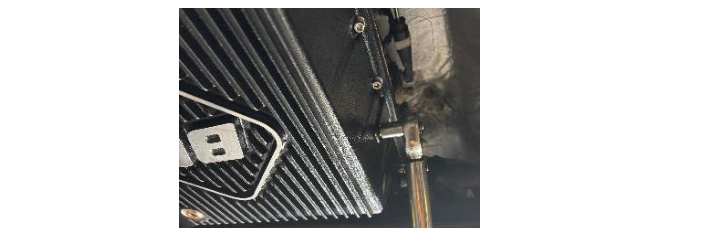Installing the 1/8 inch NPT temperature port plug with a 7/16 inch socket