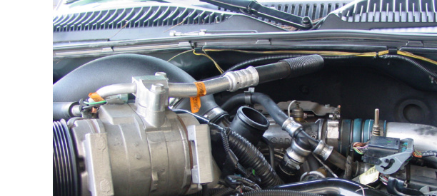 Turbo sensor location behind the A/C compressor under the rigid coolant pipe