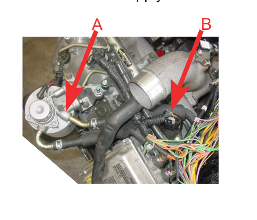 Fuel filter housing flow arrow A and fuel supply hose B