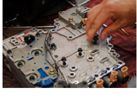 Reinstalling bolts and the valve body into the transmission case