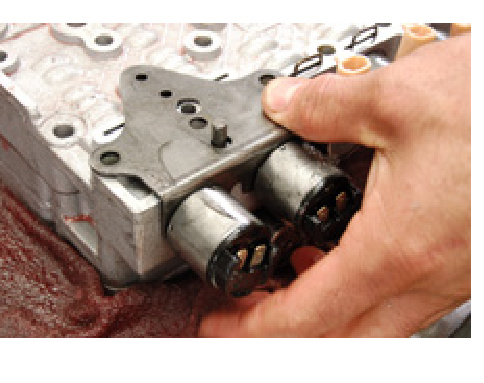 Installing the solenoid bracket onto the valve body